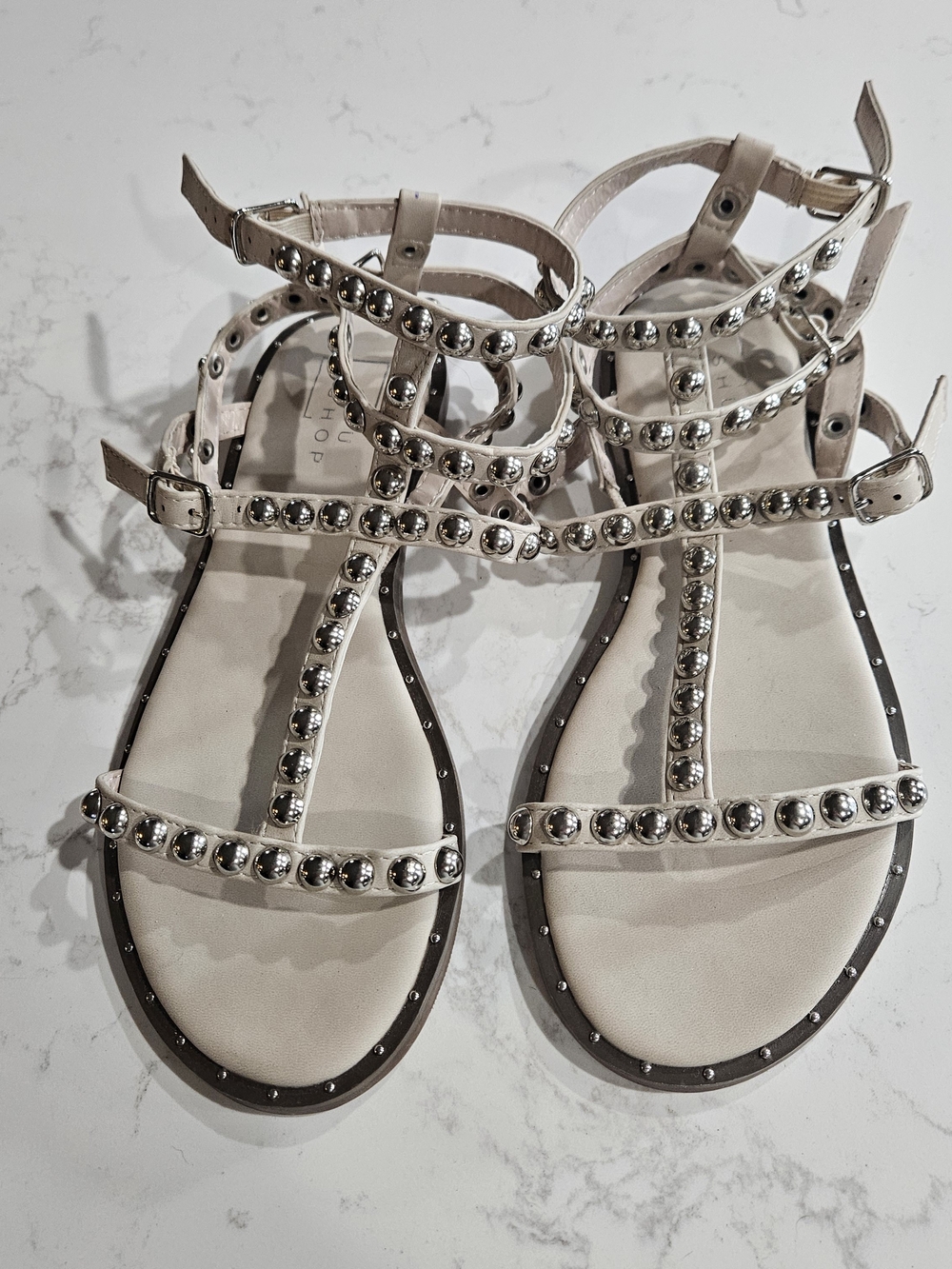 Shu Shop Studded T-Strap Flat Sandals in Beige Size 39
